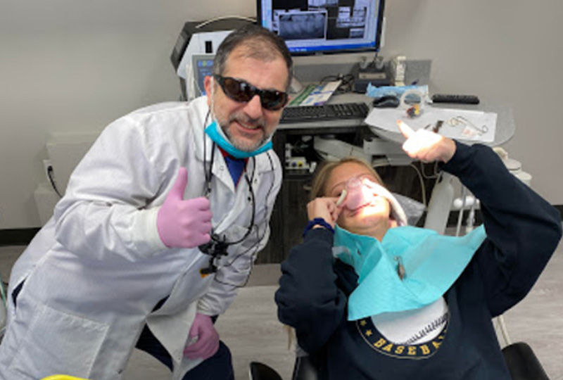 meet our dentist with happy patient